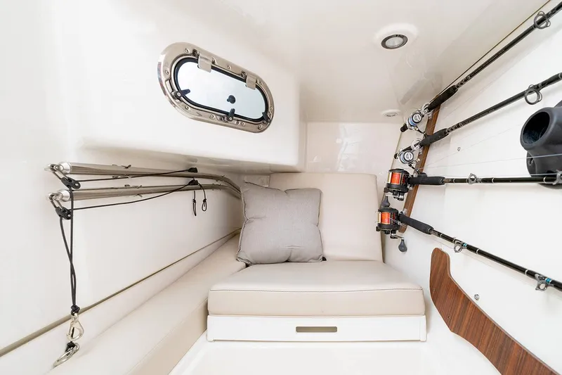 Slide: The Image of Manufacturer Provided Image: 2024 Pursuit DC 326 Dual Console cabin with fishing rod storage. - 19
