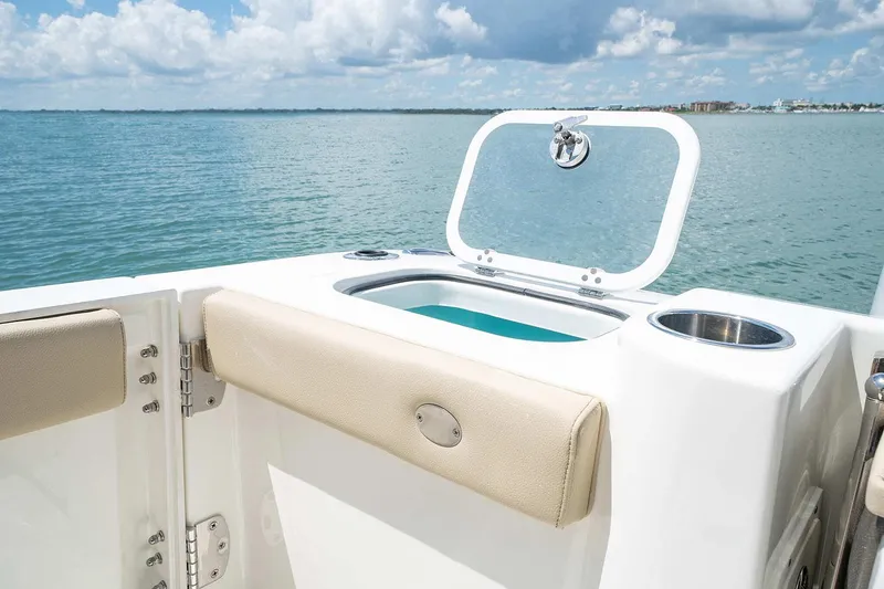 Slide: The Image of Manufacturer Provided Image: 2024 Pursuit DC 326 Dual Console boat with open hatch and ocean view. - 18