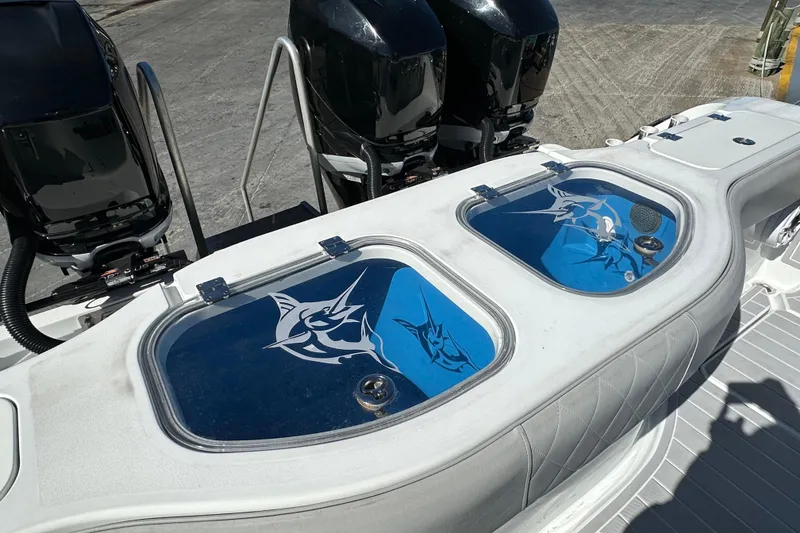 Slide: The Image of Freeman 42LR 2023 boat with dual livewells and powerful outboard engines. - 2