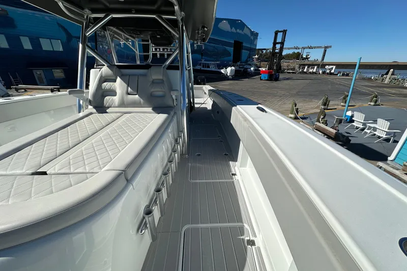 Slide: The Image of 2023 Freeman 42LR boat interior with cushioned seating and sleek design. - 5