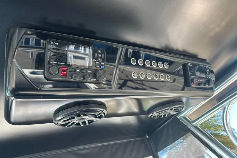 Slide: The Image of Control panel of 2023 Freeman 42LR boat with Icom marine radio and speakers. - 15