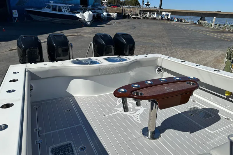 Slide: The Image of Freeman 42LR 2023 boat deck with multiple outboard motors and fishing rod holders. - 6