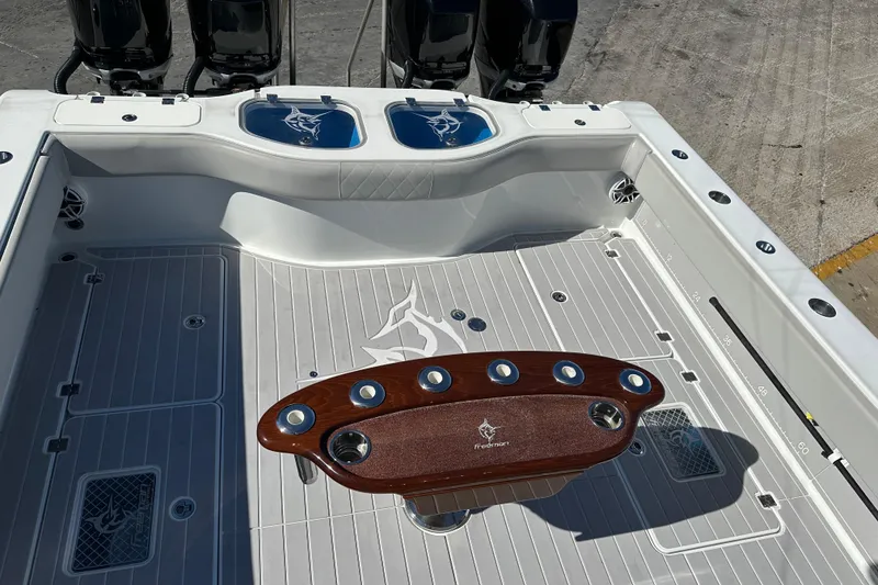 Slide: The Image of 2023 Freeman 42LR boat deck with fishing rod holders and sleek design. - 7