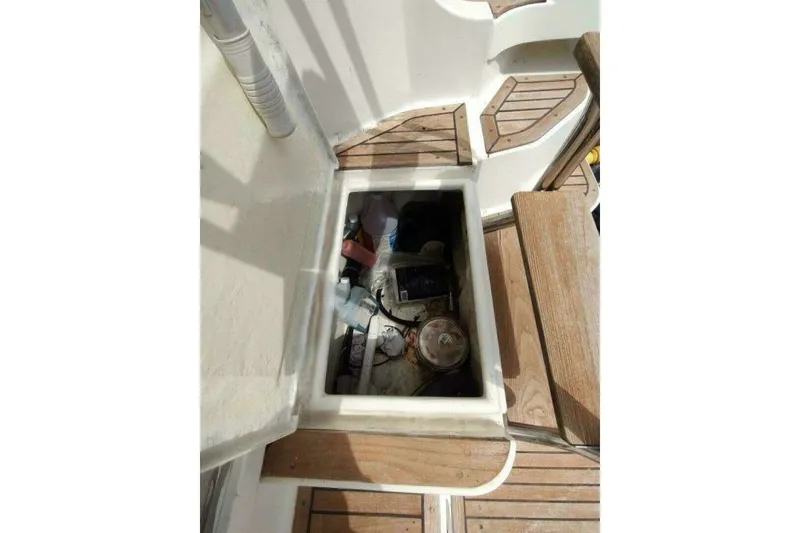 Slide: The Image of Open hatch on 1996 Grand Banks 40 Eastbay FB, revealing storage compartment. - 15