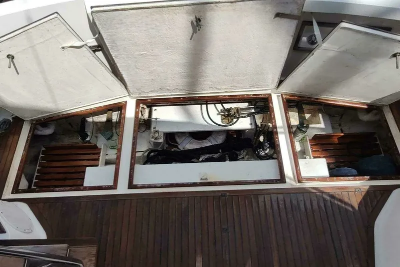 Slide: The Image of Engine compartment of 1996 Grand Banks 40 Eastbay FB with open hatches and visible machinery. - 13