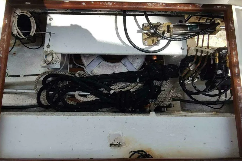 Slide: The Image of Storage compartment of a 1996 Grand Banks Eastbay 40 Flybridge with ropes and equipment. - 21