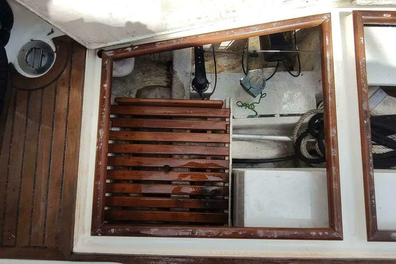 Slide: The Image of Engine compartment of 1996 Grand Banks Eastbay 40 Flybridge with wooden slats and nautical equipment. - 20