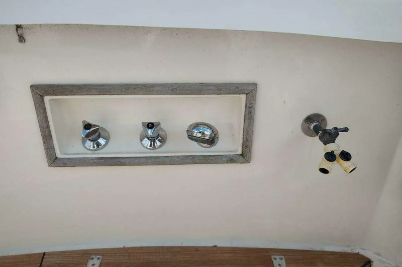 Slide: The Image of Control panel and faucet on 1996 Grand Banks Eastbay 40 Flybridge boat. - 17