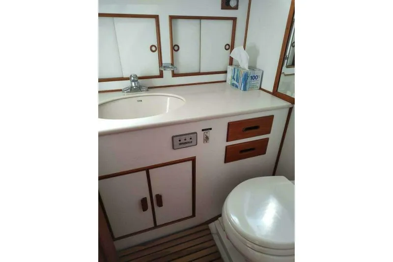 Slide: The Image of Bathroom interior of 1996 Grand Banks Eastbay 40 Flybridge with sink and toilet. - 88