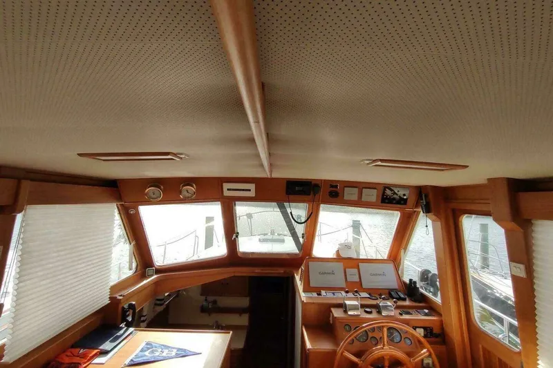 Slide: The Image of Interior of 1996 Grand Banks Eastbay 40 Flybridge with wooden helm and navigation equipment. - 25