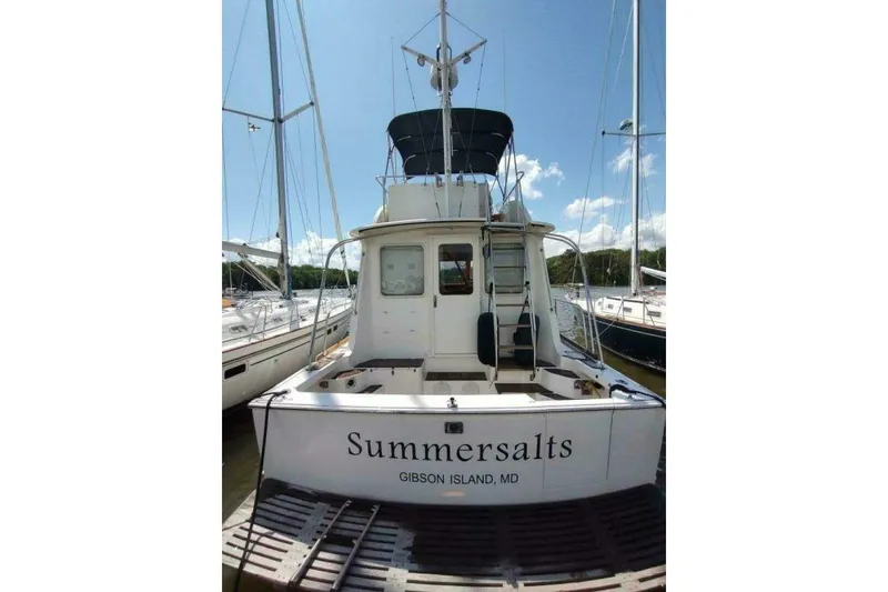 Slide: The Image of 1996 Grand Banks Eastbay 40 Flybridge yacht docked, named "Summersalts," at Gibson Island, MD. - 9