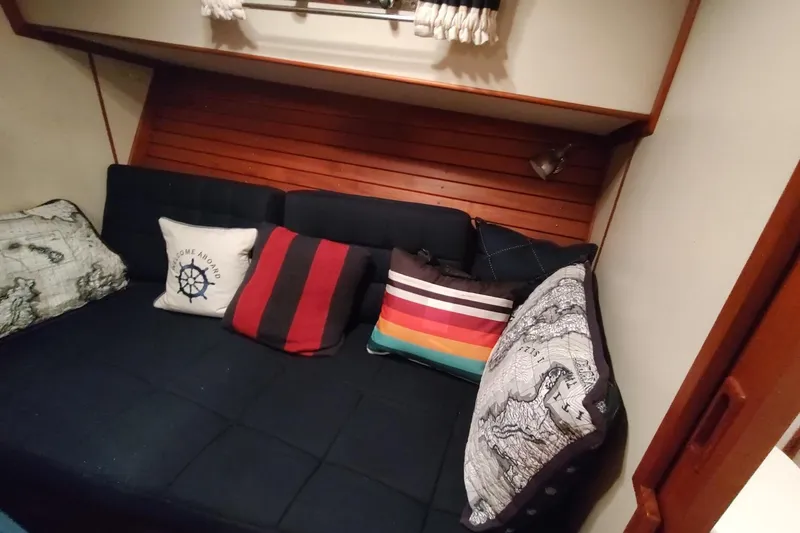 Slide: The Image of Cozy cabin interior of 1996 Grand Banks Eastbay 40 Flybridge with colorful cushions. - 71