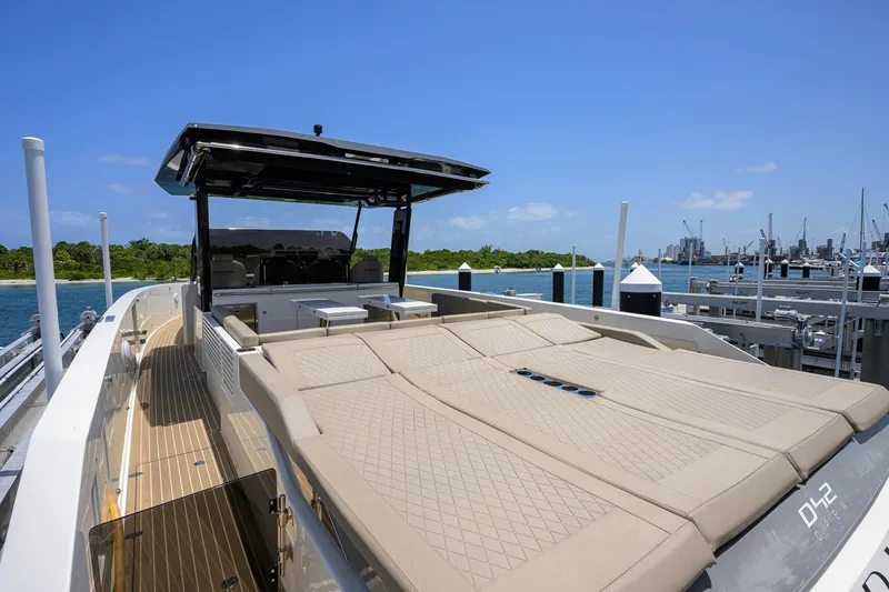 Slide: The Image of 2023 De Antonio Yachts D42 Open luxury yacht docked, featuring spacious sunbathing area. - 14