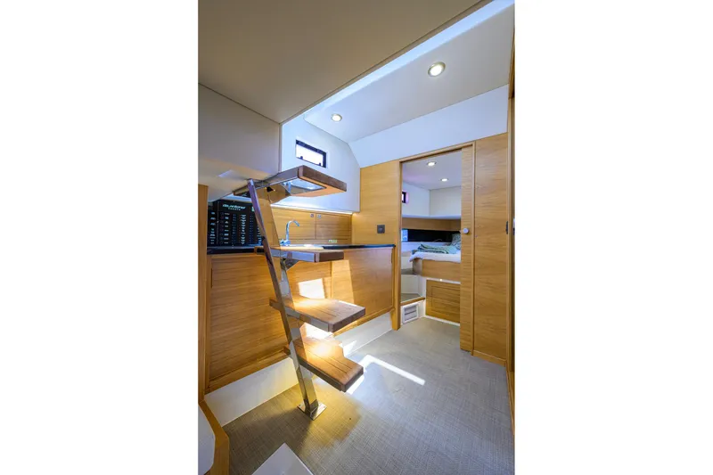 Slide: The Image of Interior of 2023 De Antonio Yachts D42 Open, featuring modern wood finishes and compact design. - 27