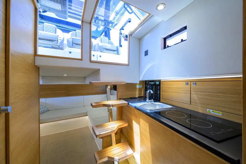 Slide: The Image of Luxurious interior of 2023 De Antonio Yachts D42 Open, featuring modern kitchen and seating area. - 29
