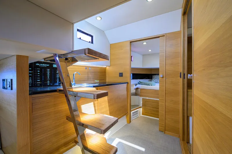 Slide: The Image of Interior of 2023 De Antonio Yachts D42 Open, featuring modern wood finishes and compact design. - 26