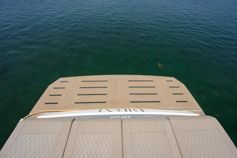 Slide: The Image of 2023 De Antonio Yachts D42 Open, rear deck view over clear water. - 54