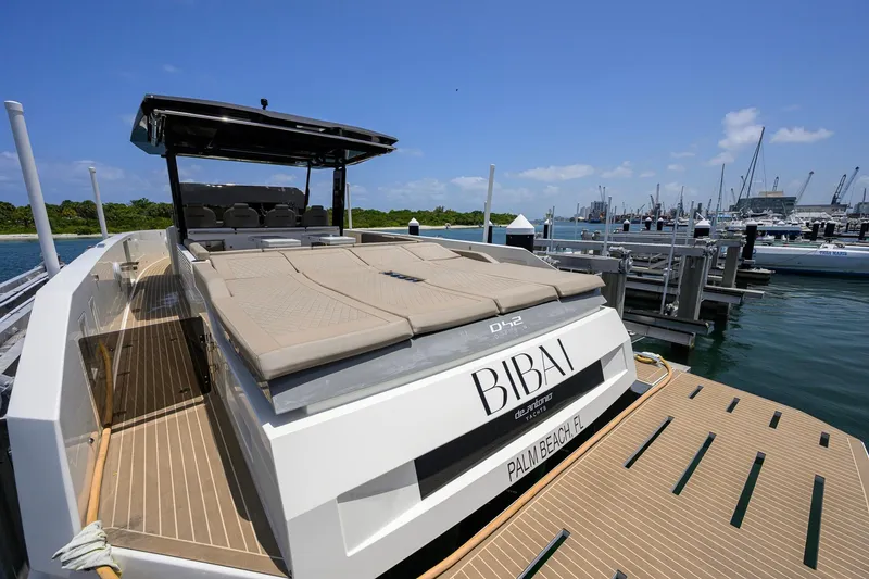 Slide: The Image of 2023 De Antonio Yachts D42 Open docked in a marina under clear blue skies. - 53