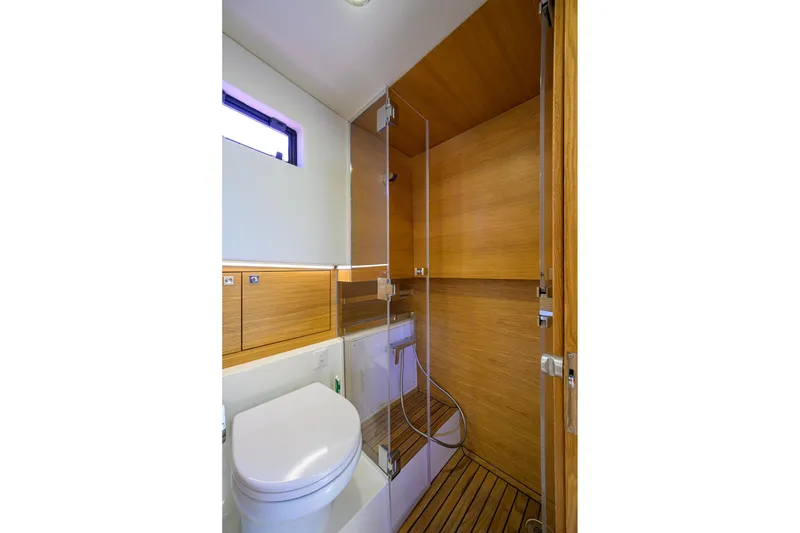 Slide: The Image of Luxurious bathroom in 2023 De Antonio Yachts D42 Open, featuring modern wood finishes and sleek design. - 34