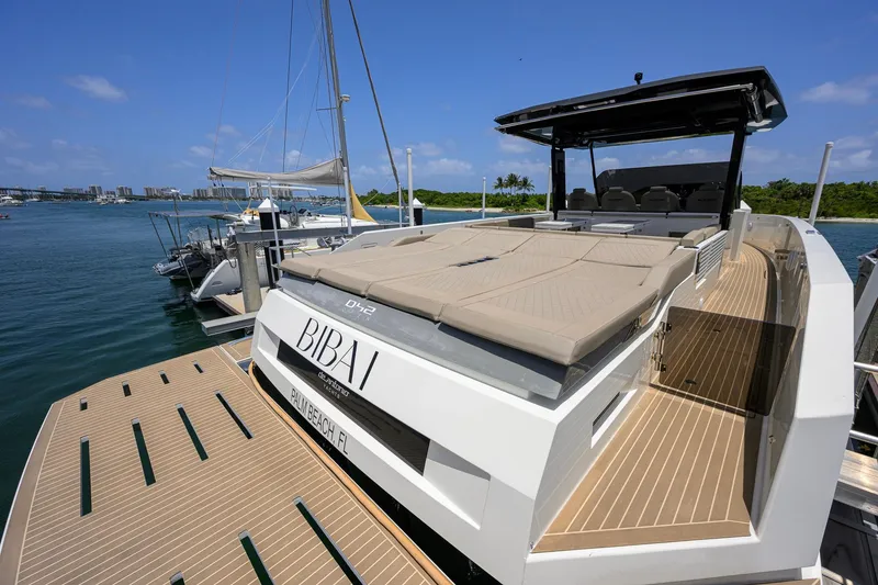 Slide: The Image of 2023 De Antonio Yachts D42 Open docked, featuring sleek design and spacious deck. - 51