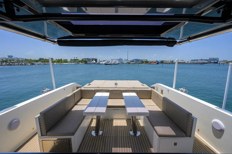 Slide: The Image of Luxurious 2023 De Antonio Yachts D42 Open with elegant seating and scenic waterfront view. - 7