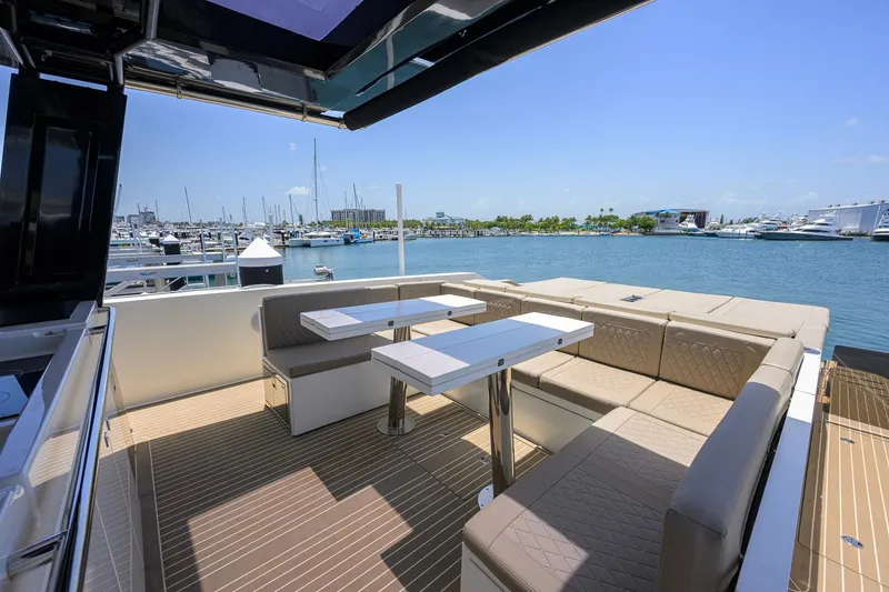 Slide: The Image of Luxurious seating area on 2023 De Antonio Yachts D42 Open, overlooking marina. - 9