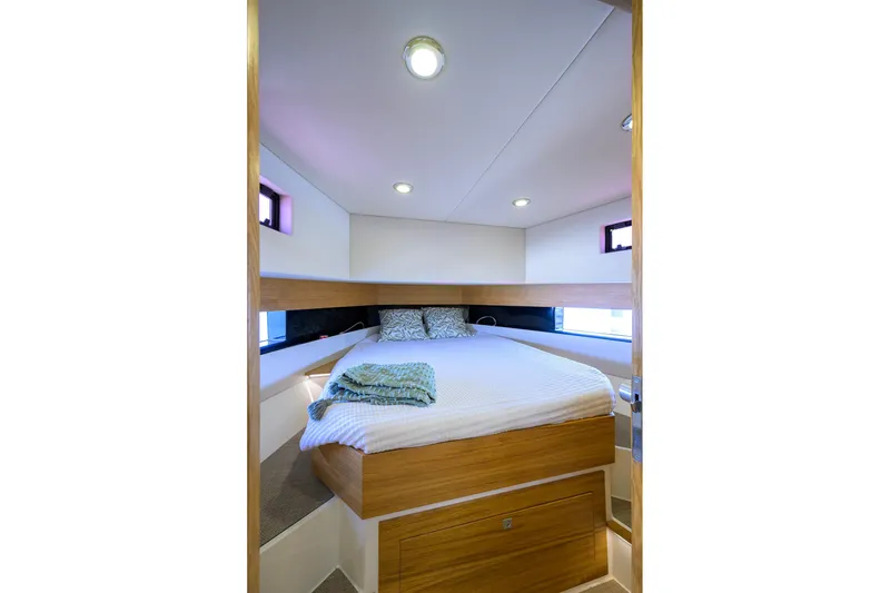 Slide: The Image of Luxurious cabin interior of 2023 De Antonio Yachts D42 Open, featuring a cozy bed and modern design. - 22