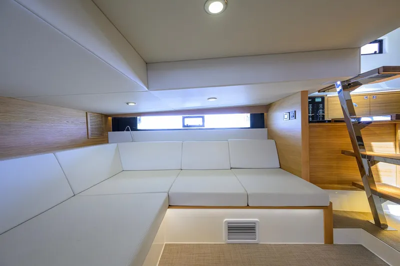 Slide: The Image of Luxurious interior of 2023 De Antonio Yachts D42 Open with modern seating and wooden accents. - 47