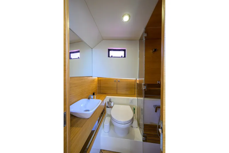 Slide: The Image of Luxurious bathroom in 2023 De Antonio Yachts D42 Open, featuring modern fixtures and wood accents. - 31