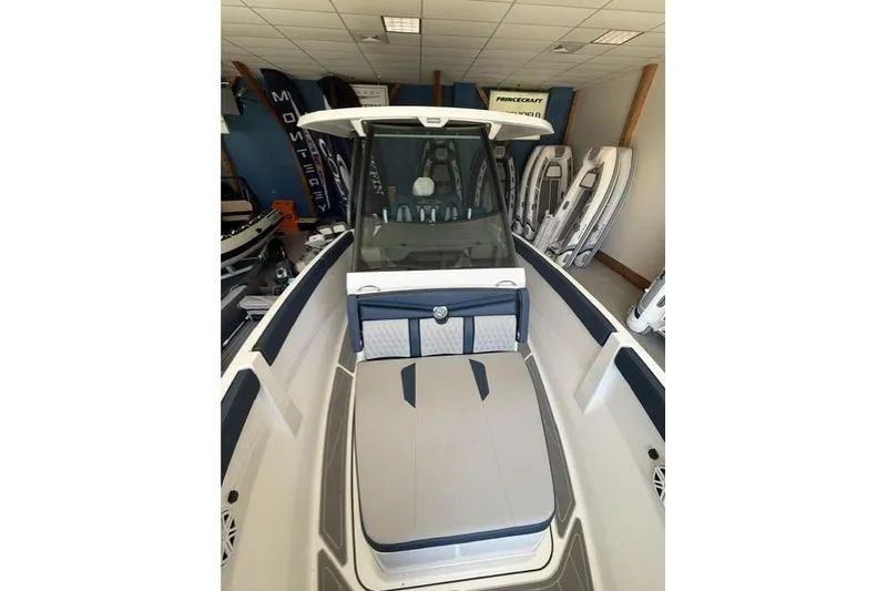 Slide: The Image of 2026 Monterey Elite 25 OB boat interior with modern seating and sleek design. - 9