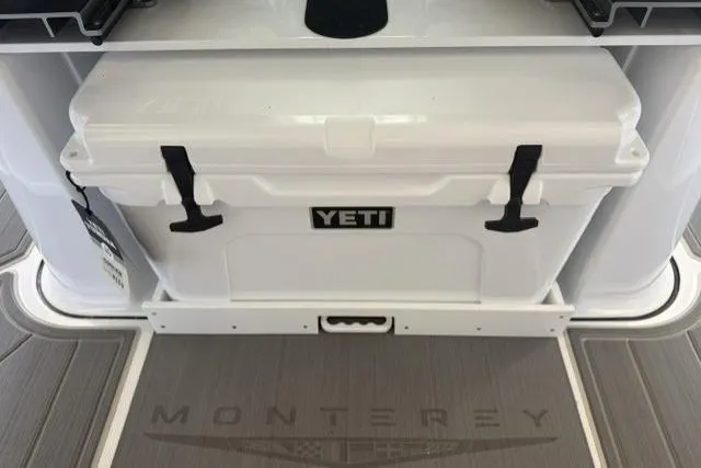 Slide: The Image of YETI cooler on 2026 Monterey Elite 25 OB boat deck. - 7