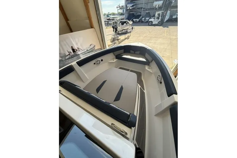 Slide: The Image of 2026 Monterey Elite 25 OB boat interior with spacious seating and modern design. - 10