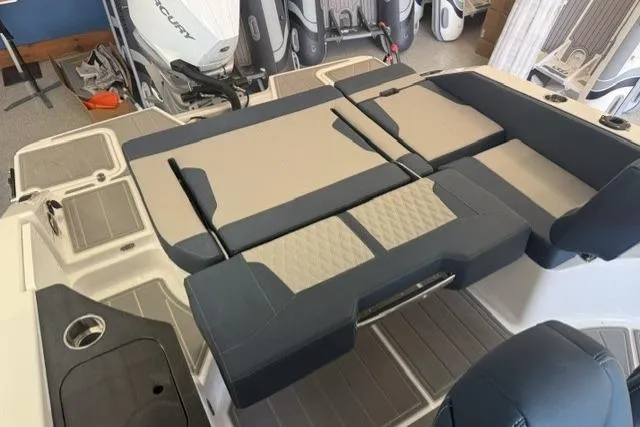 Slide: The Image of 2026 Monterey Elite 25 OB boat interior with cushioned seating and modern design. - 5