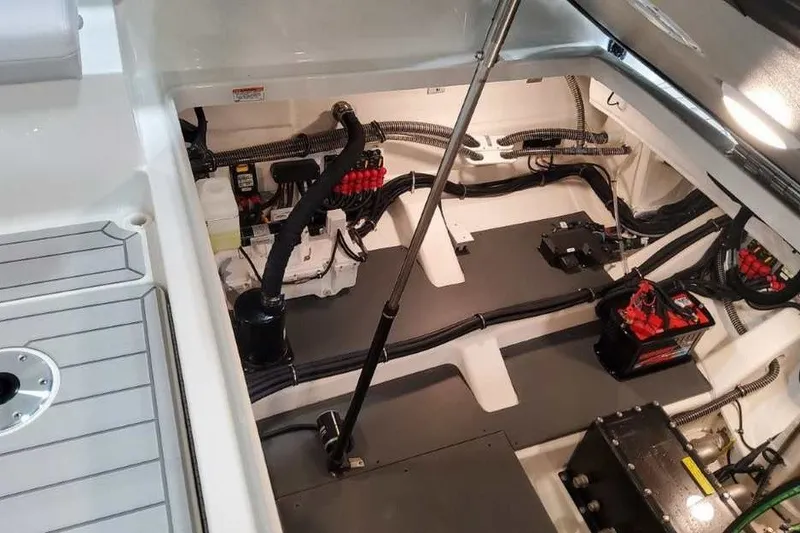 Slide: The Image of Engine compartment of 2027 Formula 360 Crossover Bowrider OB, showcasing wiring and battery setup. - 22
