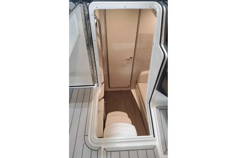 Slide: The Image of Interior view of 2027 Formula 360 Crossover Bowrider OB, featuring cabin entrance and seating. - 61