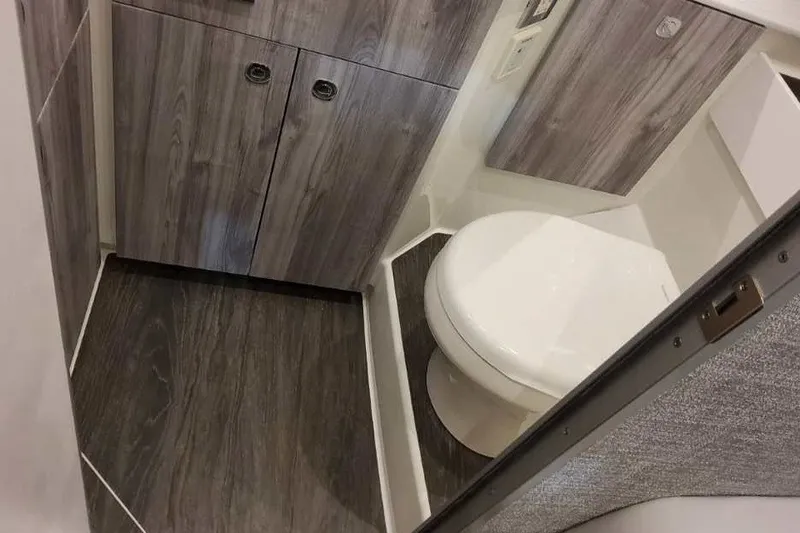Slide: The Image of Interior of 2027 Formula 360 Crossover Bowrider OB, featuring modern bathroom design. - 75