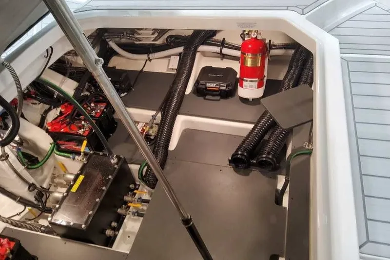 Slide: The Image of Engine compartment of 2027 Formula 360 Crossover Bowrider OB with fire extinguisher and wiring. - 23