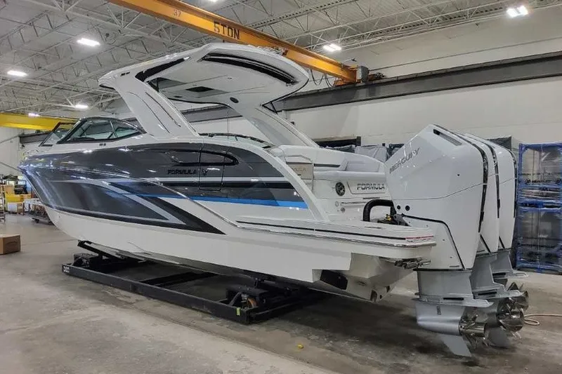 Slide: The Image of 2027 Formula 360 Crossover Bowrider OB in a showroom, featuring sleek design and powerful engines. - 10