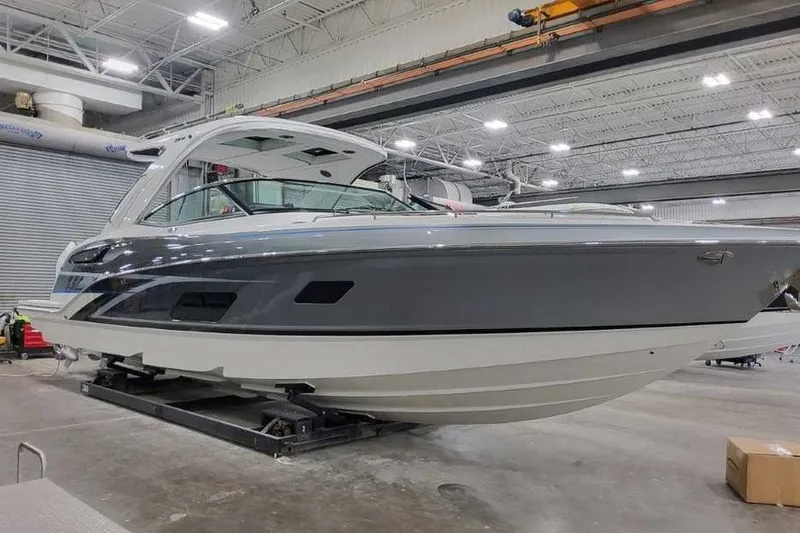 Slide: The Image of 2027 Formula 360 Crossover Bowrider OB in a showroom, showcasing sleek design and modern features. - 4