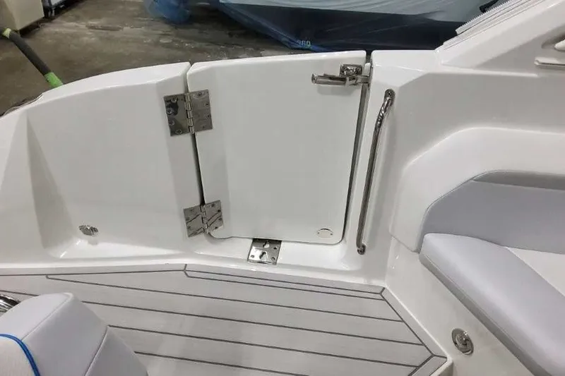 Slide: The Image of 2027 Formula 360 Crossover Bowrider OB interior with sleek white seating and stainless steel fixtures. - 14