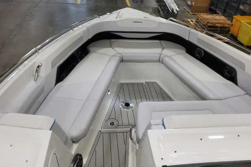 Slide: The Image of 2027 Formula 360 Crossover Bowrider OB with spacious seating and sleek design in a showroom. - 42