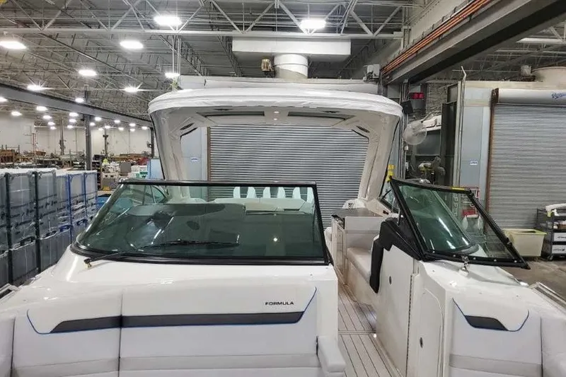 Slide: The Image of 2027 Formula 360 Crossover Bowrider OB in a warehouse setting, showcasing sleek design. - 55