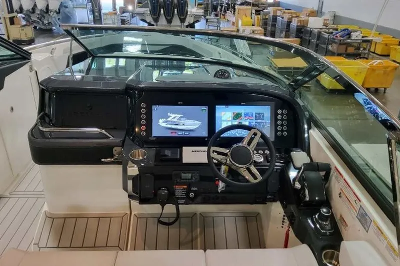 Slide: The Image of 2027 Formula 360 Crossover Bowrider OB dashboard with modern controls and navigation screens. - 38