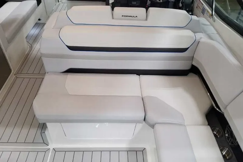 Slide: The Image of Luxurious seating on 2027 Formula 360 Crossover Bowrider OB boat, featuring sleek white upholstery. - 28