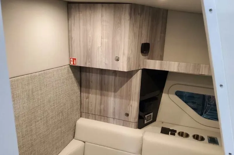 Slide: The Image of Interior of 2027 Formula 360 Crossover Bowrider OB, featuring modern wood cabinetry and seating. - 63