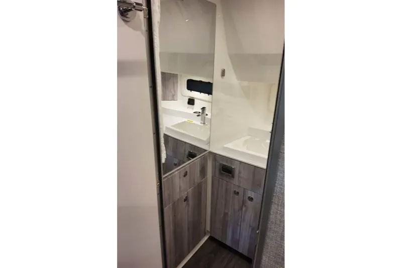 Slide: The Image of Interior of 2027 Formula 360 Crossover Bowrider OB, featuring modern cabinetry and sink. - 72