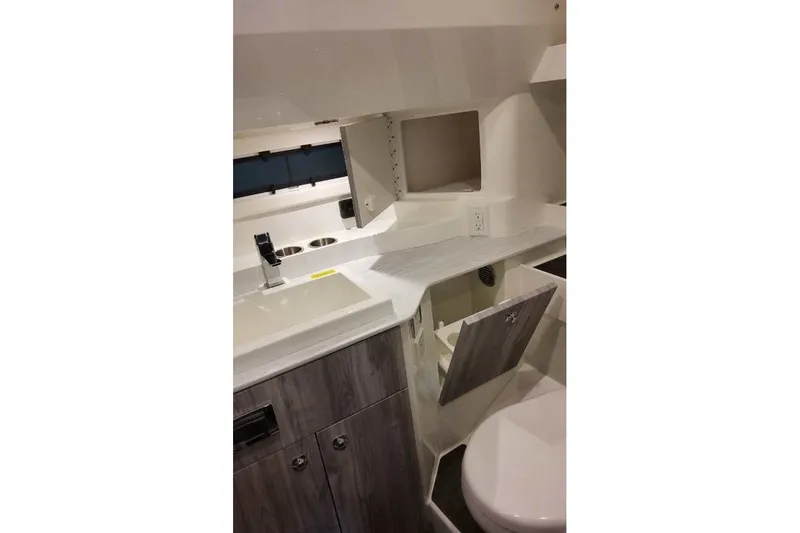 Slide: The Image of Interior of 2027 Formula 360 Crossover Bowrider OB, featuring modern bathroom amenities. - 79