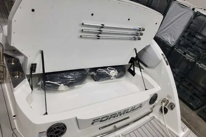 Slide: The Image of 2027 Formula 360 Crossover Bowrider OB boat storage compartment with accessories and equipment. - 18