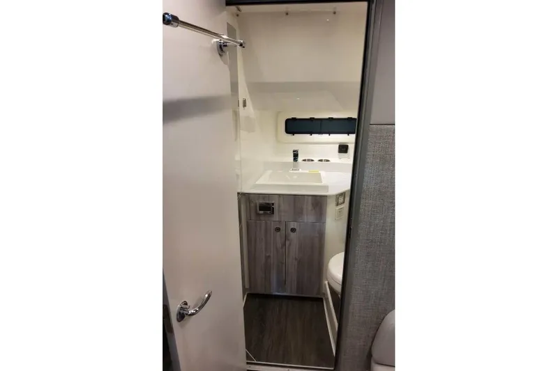 Slide: The Image of Interior of 2027 Formula 360 Crossover Bowrider OB bathroom with modern fixtures. - 71