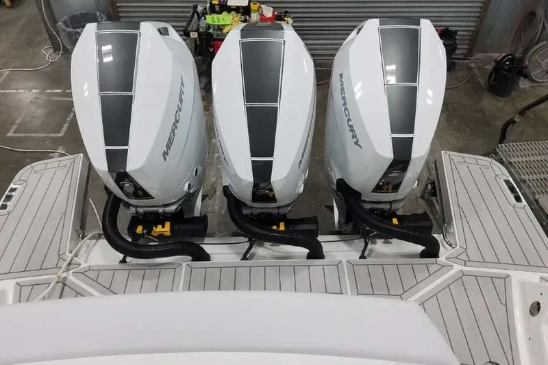 Slide: The Image of Triple Mercury outboard engines on a 2027 Formula 360 Crossover Bowrider OB boat. - 13